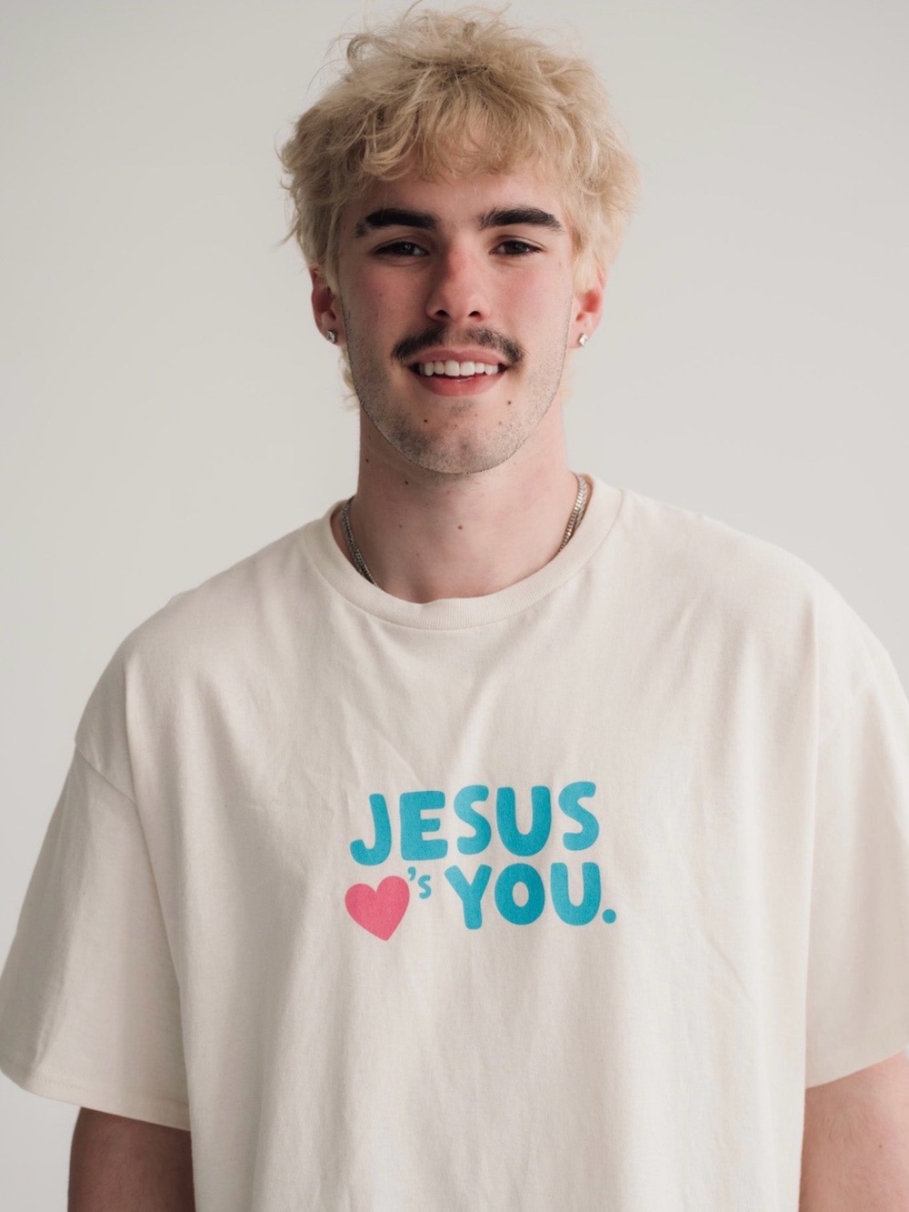 Cream Graphic Tee with Turquoise 'Jesus Loves You' Print